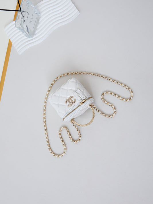 CHANEL 25S MINI VANITY BAG 11 CM IN WHITE LAMBSKIN WITH CRYSTAL-EMBELLISHED LOGO