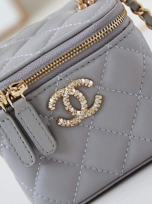 CHANEL 25S MINI VANITY BAG 11 CM IN GREY LAMBSKIN WITH CRYSTAL-EMBELLISHED LOGO