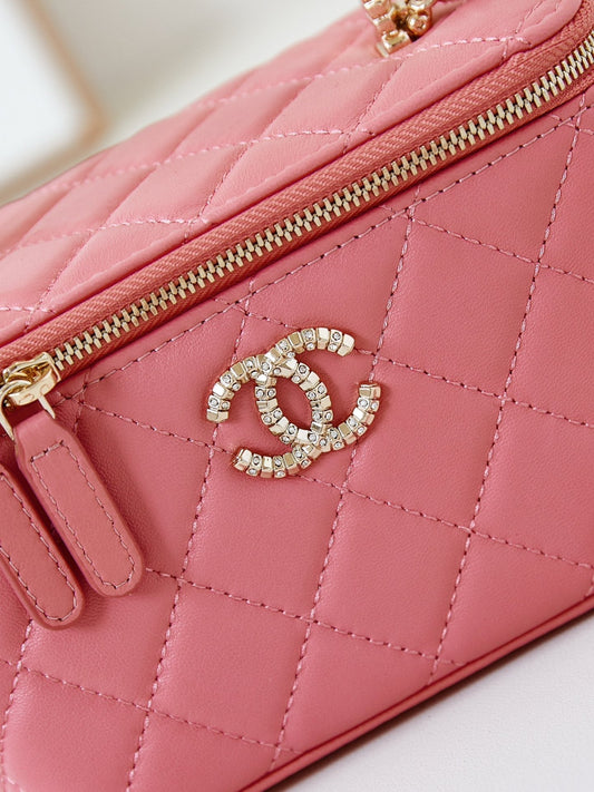 CHANEL 25S MINI VANITY BAG 16 CM IN PEACHY PINK LAMBSKIN WITH CRYSTAL-EMBELLISHED LOGO