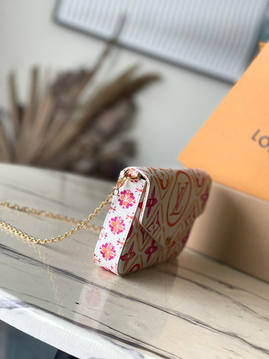 LOUIS VUITTON FÉLICIE POCHETTE 21 IN CORAL MONOGRAM TILES CANVAS