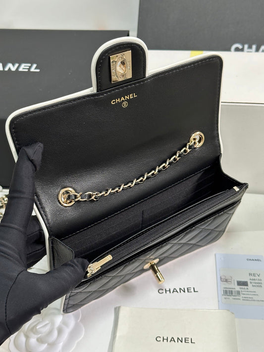 CHANEL QUILTED FLAP BAG WITH WHITE TRIM 19 IN BLACK LAMBSKIN