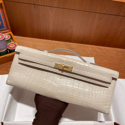 HERMES KELLY CUT 31 IN WHITE CREAM ALLIGATOR LEATHER WITH GOLD HARDWARE