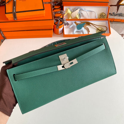 HERMES KELLY CUT 31 IN GREEN FOREST CALFSKIN WITH SILVER HARDWARE