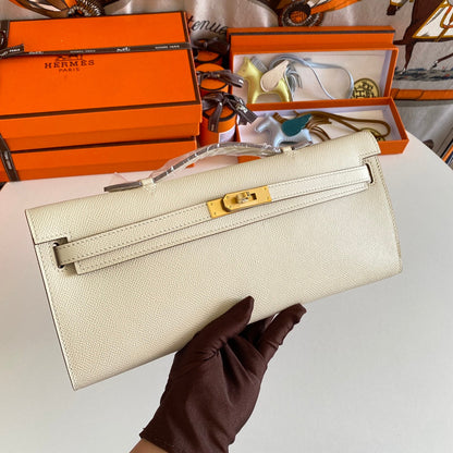 HERMES KELLY CUT 31 IN BEIGE CREAM CALFSKIN WITH GOLD HARDWARE