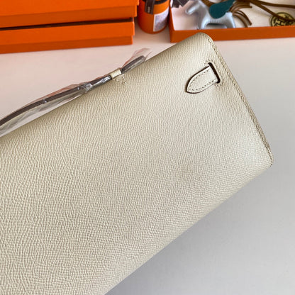 HERMES KELLY CUT 31 IN BEIGE CREAM CALFSKIN WITH SILVER HARDWARE