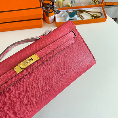 HERMES KELLY CUT 31 IN WATERMELON PINK CALFSKIN WITH GOLD HARDWARE
