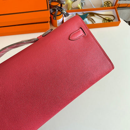 HERMES KELLY CUT 31 IN WATERMELON PINK CALFSKIN WITH GOLD HARDWARE