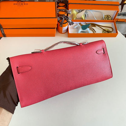 HERMES KELLY CUT 31 IN WATERMELON PINK CALFSKIN WITH SILVER HARDWARE