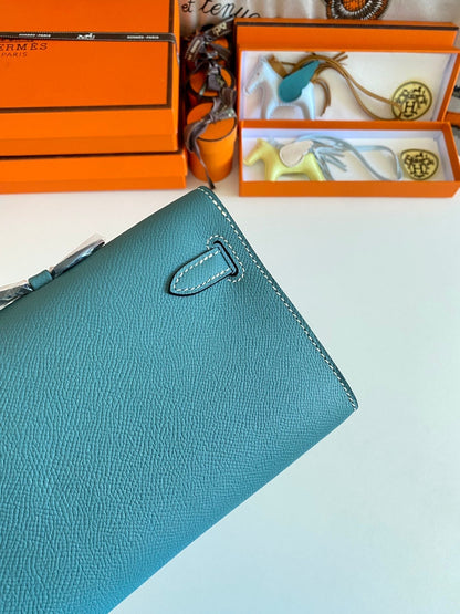 HERMES KELLY CUT 31 IN AZURE BLUE CALFSKIN WITH GOLD HARDWARE