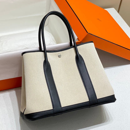 HERMES GARDEN PARTY 36CM IN WHITE TOILETS COTTON CANVAS AND BLACK CALFSKIN