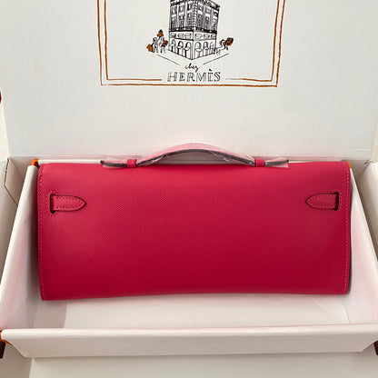 HERMES KELLY CUT 31 IN CHERRY RED CALFSKIN WITH GOLD HARDWARE