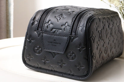 LOUIS VUITTON DOPP KIT TOILETRY BAG 28 CM IN BLACK TAURILLON MONOGRAM LEATHER