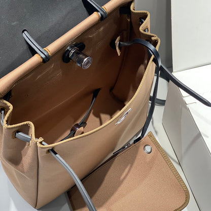 HERMES HERBAG A DOS ZIP RETOURNE BACKPACK 29 IN BROWN CANVAS AND BLACK CALFSKIN