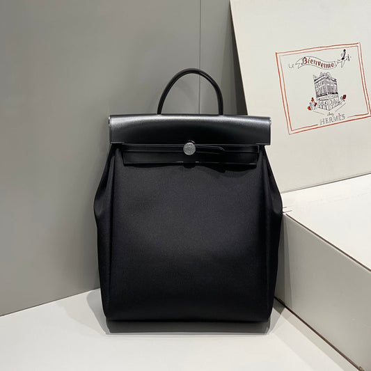 HERMES HERBAG A DOS ZIP RETOURNE BACKPACK 29 IN BLACK CANVAS AND CALFSKIN