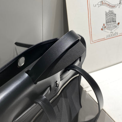 HERMES HERBAG A DOS ZIP RETOURNE BACKPACK 29 IN BLACK CANVAS AND CALFSKIN