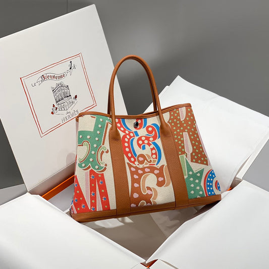 HERMES GARDEN PARTY 36 IN MULTICOLOR TOILE H CANVAS GOLD CALFSKIN CIRCUS TYPOGRAPHY PRINT