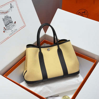 HERMES GARDEN PARTY 30CM IN DARK BEIGE TOILETS COTTON CANVAS AND BLACK CALFSKIN