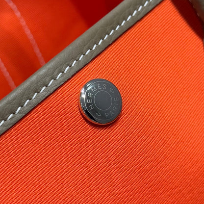 HERMES GARDEN PARTY 30CM IN ORANGE MINIMUM TOILETS COTTON CANVAS AND BROWN CALFSKIN