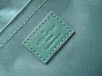 LOUIS VUITTON POCHETTE VOYAGE SOUPLE 32 IN GREEN MONOGRAM HERITAGE CANVAS