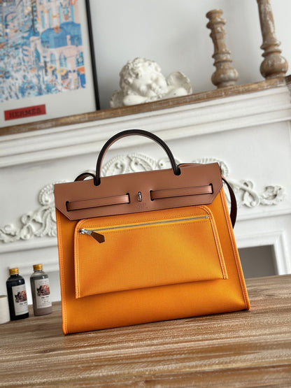 HERMES ZIP CABINE 31 BAG IN APRICOT ORANGE CANVAS AND BRONZE BROWN CALFSKIN