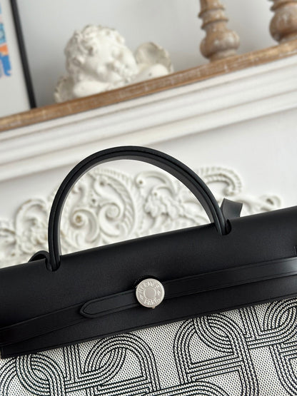 HERMES HERBAG ZIP 31 LAQUERED BAG IN OFF-WHITE MIX BLACK H PLUME CANVAS