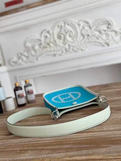 HERMES MINI NEO 17 EVELYNE BAG IN SKY BLUE CANVAS AND WHITE CALFSKIN