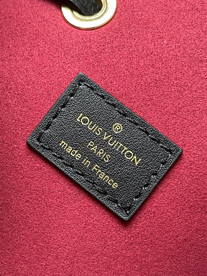 LOUIS VUITTON CRAFTY NEONOE 26 IN BLACK AND CREAM BICOLOR EMPREINTE CALFSKIN