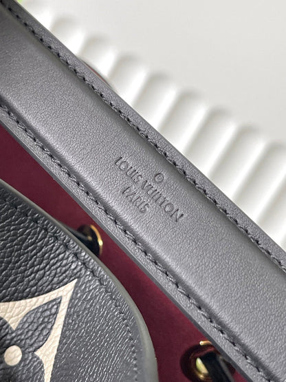 LOUIS VUITTON CRAFTY NEONOE 26 IN BLACK AND CREAM BICOLOR EMPREINTE CALFSKIN