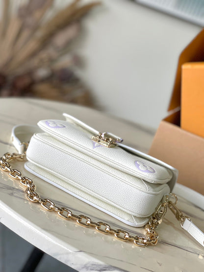 LOUIS VUITTON POCHETTE METIS EAST WEST 21 IN WHITE PURPLE MONOGRAM EMPREINTE LEATHER