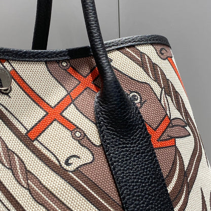 HERMES GARDEN PARTY 36 IN BEIGE ORANGE AND BROWN TOILE H CANVAS BLACK CALFSKIN HORSE TOTEM PRINT